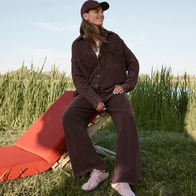 woman with brown Z-Supply set on with tall grass in the background